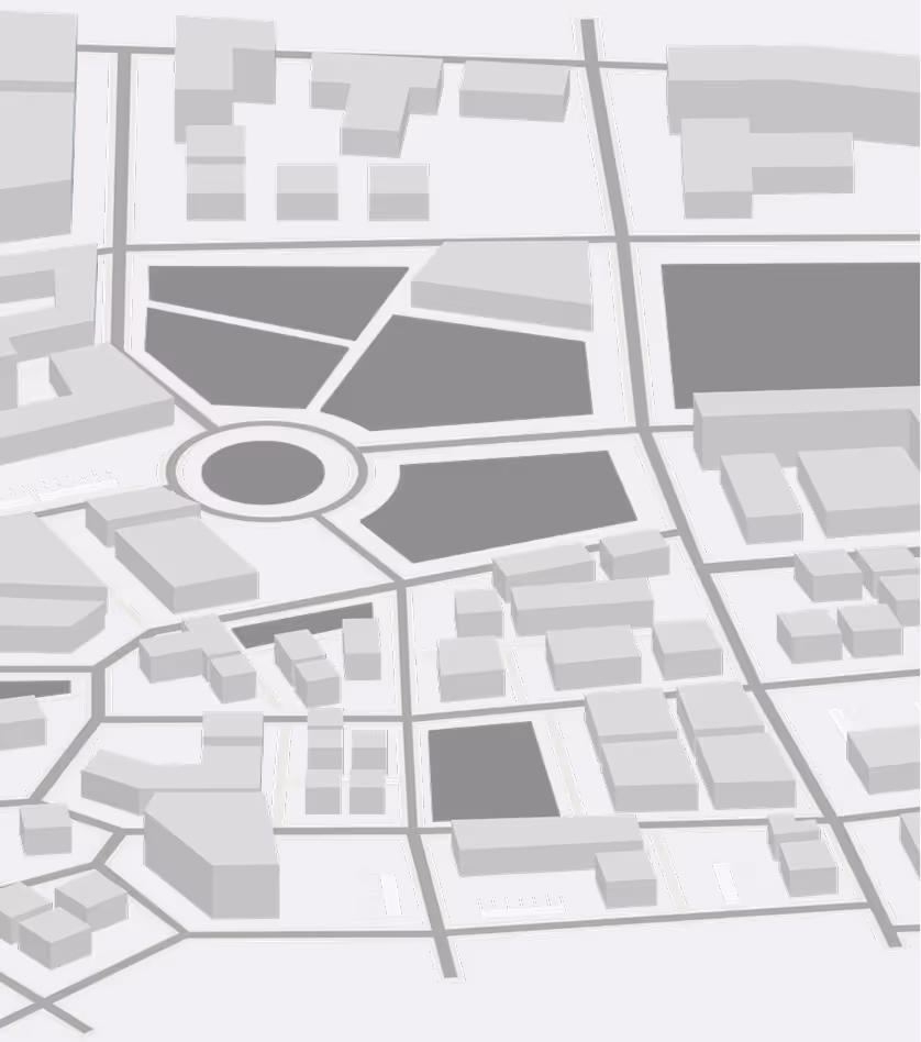 3D rendered map model showing various buildings, roads, and a roundabout in shades of gray and white.